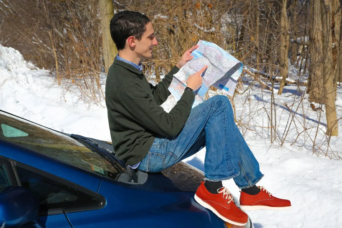 Sitting on the car wearing his Rust Nubuck Hubbard Free 